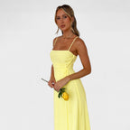 Flossie™ | Vestido maxi amarillo con lazo lateral