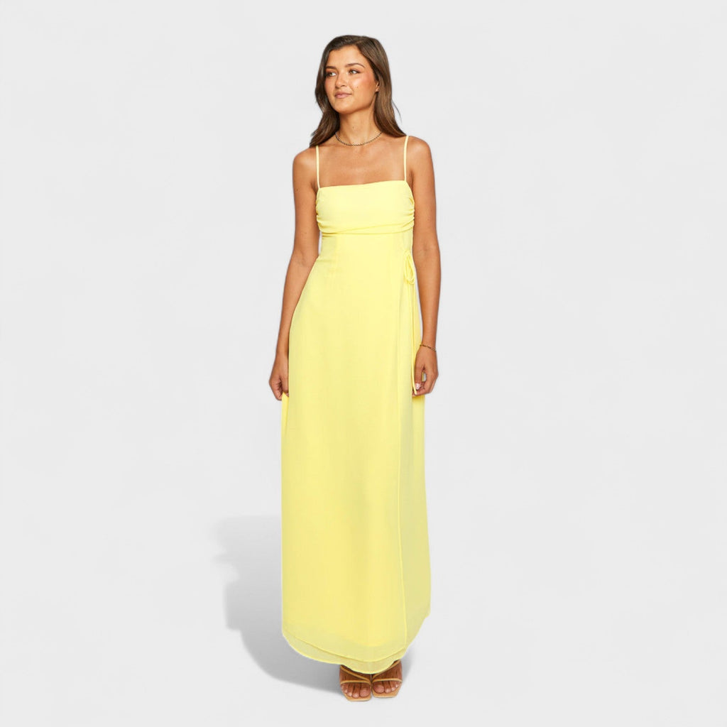 Flossie™ | Vestido maxi amarillo con lazo lateral
